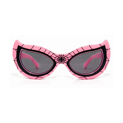 Pink cat-eye sunglasses with a black spiderweb pattern on the frame and dark gray lenses, shown against a plain white background.