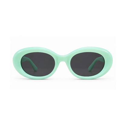 Sunglasses with gold frame and red lenses on a white background