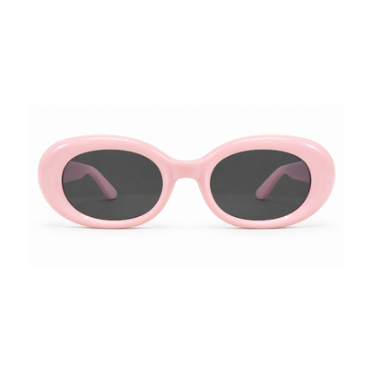 Oval sunglasses with a glossy light pink frame and dark gray lenses, shown against a plain white background.