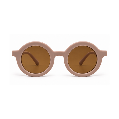 Round sunglasses with a matte dusty pink frame and warm brown tinted lenses, shown against a clean white background.