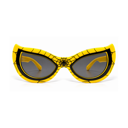 Yellow and black spider-themed cat-eye sunglasses with a web pattern and spider emblem on the bridge, shown against a plain white background.